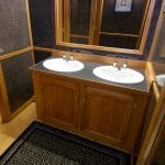Majestic Restroom Trailer Marble sinks with framed mirror